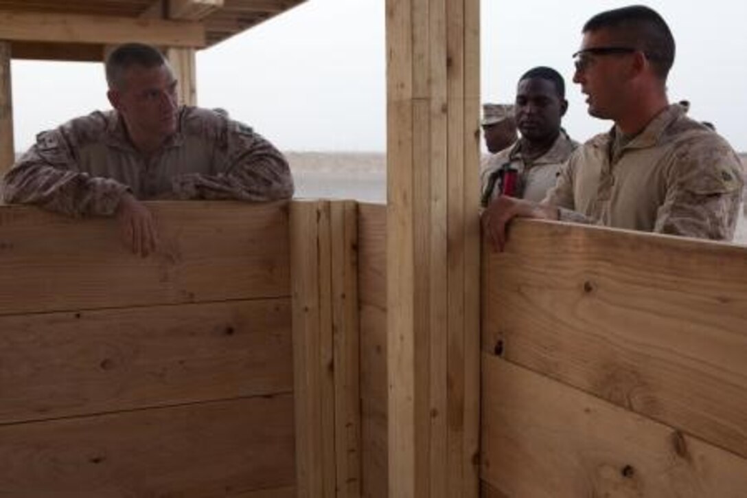 U.S. Marine Sgt. Maj. Roger Griffith, left, sergeant major of Combat Logistics Regiment 2, Regional Command (Southwest), speaks with Sgt. Chad Jordan, a combat engineer with Engineer Company, CLR-2, during his visit to Camp Dwyer, Helmand province, Afghanistan, Aug. 7, 2013. Griffith conducted the visit to inspect the wellbeing of his Marines. (U.S. Marine Corps photo by Sgt. Anthony L. Ortiz / Released)

