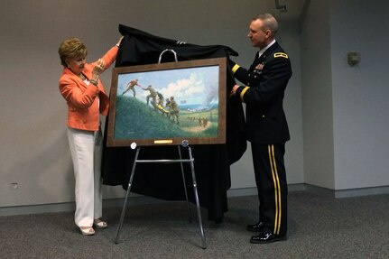 U.S. Rep. Madeline Bordallo, left, of Guam, and Army Brig. Gen. Walter E. Fountain, acting deputy director of the Army National Guard, unveil the newest National Guard Heritage Painting "Tragedy in Paradise—The Recovery of Flight 801" during the celebrations of Asian-American and Pacific Islander Heritage Month at the Army National Guard Readiness Center in Arlington, Va., May 16, 2013.