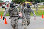 Soldiers from the 4th Battalion, 118th Infantry Regiment, S.C. Army National Guard, carry an injured civilian to the decontaminated site in front of the Hampton Regional Medical Center, Varnville, S.C., as part of Ardent Sentry, a major NORAD and USNORTHCOM-sponsored exercise.