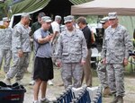 Lt. Gen. Joseph Lengyel, vice chief, National Guard Bureau (center), and Maj. Gen. Emmett Titshaw, adjutant general of Florida, are briefed by a Soldier assigned to the 48th Civil Support Team during Operation Vigilant Guard 2013, May 19, 2013.