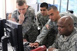 Soldiers from the Fairfax, Va.-based Data Processing Unit conduct a computer network defense exercise Sept. 15, 2012, in Fairfax. The exercise used different cyber scenarios of varying difficulty in order to evaluate the proficiency levels of the unit's Soldiers in computer network defense.