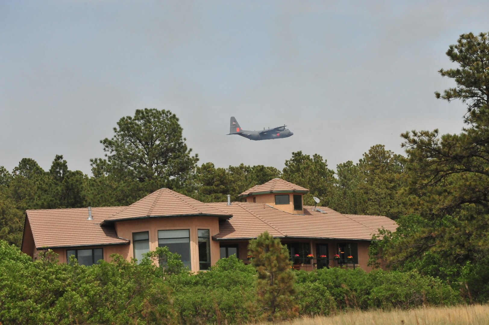 A Modular Airborne Firefighting System-equipped C-130s from the 302nd Airlift Wing is providing firefighting assistance to civil authorities at the Black Forest fire in El Paso County, Colo., June 12, 2013.