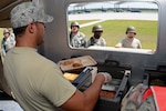 Airman 1st Class Luis Sanchez, a services specialist with the 169th Services Flight at McEntire Joint National Guard Base, South Carolina Air National Guard, serves food from the Single Palletized Expeditionary Kitchen during the June Unit Training Assembly Readiness Exercise, June 1, 2013.
