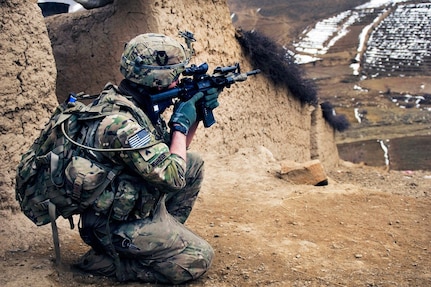 U.S. Army Sgt. Cullen Wurzer, with the Iowa Army National Guard's Troop B, 1st Squadron, 113th Cavalry Regiment, scans a nearby mountain range during a search of a village in Patwan Province, Afghanistan. The National Guard is "all in" when it comes to providing forces for ongoing and future deployments, said Army Gen. Frank Grass, chief of the National Guard Bureau, in a memo to the Army and Air Force chiefs of staff.