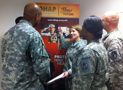 Maj. Christine Ludwig, program executive officer, Deployment Health Assessment Program, answers questions from Soldiers about the Deployment Health Assessments.