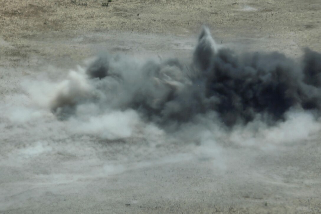 An M67 Fragmentation Grenade explodes propelling burning shrapnel on an impact zone on Range 109 here Aug. 13. Twenty-four Marines with Marine Air Support Squadron 3 of 3rd Marine Aircraft Wing here conducted live-fire grenade training here.

