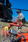 Preparing the Bambi Bucket, June 21, 2013, Sgt. Nicholas Parrott is a member of the Colorado Army National Guard's 2nd Battalion of the 135th Aviation Regiment, stationed at Buckley Air Force Base, Aurora, Colo.
