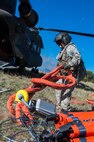 Preparing the Bambi Bucket, June 21, 2013, Sgt. Nicholas Parrott is a member of the Colorado Army National Guard's 2nd Battalion of the 135th Aviation Regiment, stationed at Buckley Air Force Base, Aurora, Colo.