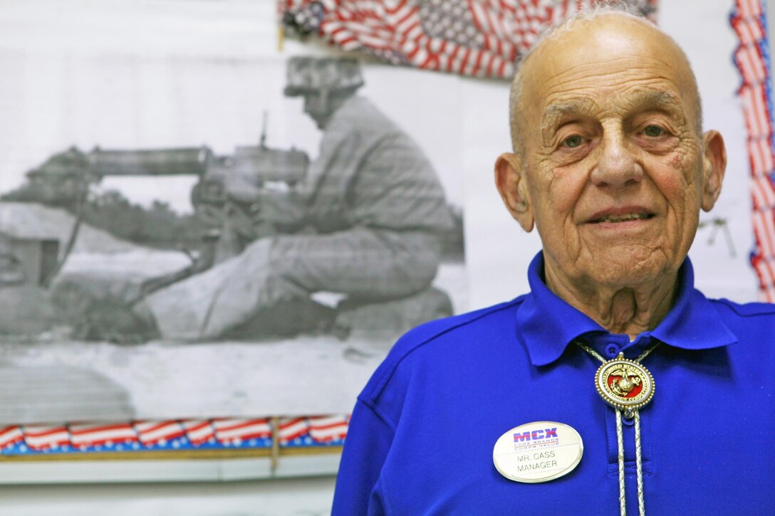 Retired Sgt. Maj. Marion P. Carcirieri, manager at the Marine Mart aboard Camp Geiger, stands in front of a photograph of himself during the Vietnam War in the Marine Mart staff office, Aug. 5. Carcirieri fought at the Battle of Okinawa, in the Korean War and in the Vietnam War during his 31 year Marine Corps career. Carcirieri’s brother also fought at the Battle of Okinawa on the other side of the island. “It was a really memorable experience for me,” Carcirieri said. “It was a great feeling we had both made it through there.”
Find us on Google + (http://gplus.to/camp.lejeune)
Follow us on Twitter (http://twitter.com/camp_lejeune)
Like us on Facebook (http://www.facebook.com/camp.lejeune)
