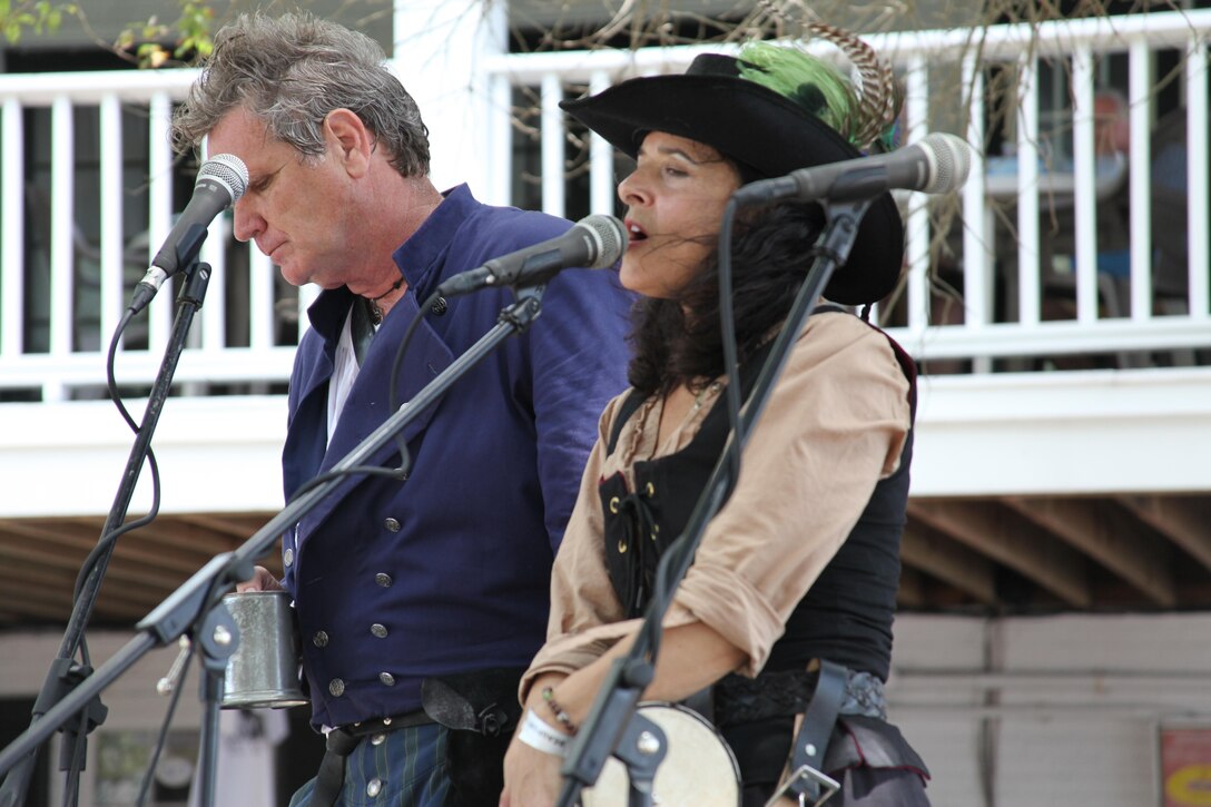 Laura J. Bradford and Jerry A. Bragg, of Thunder and Spice, entertain visitors during the Beaufort Pirate Invasion Friday. 