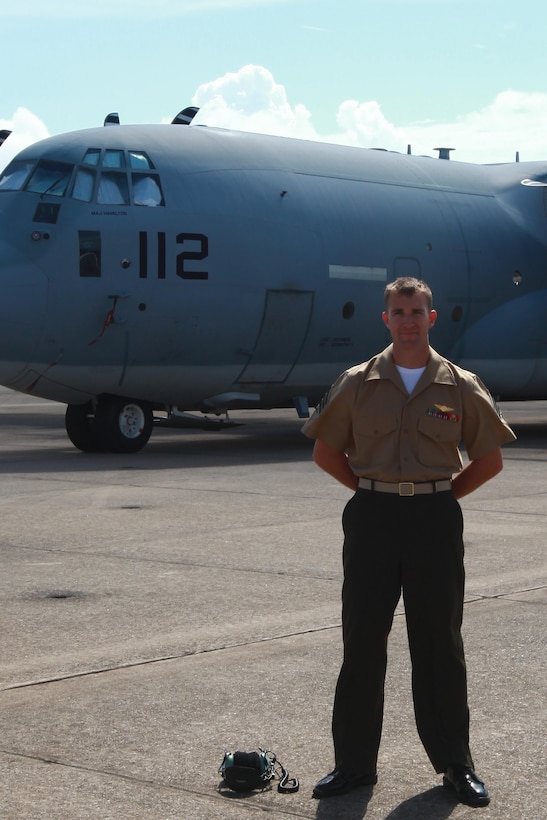 Sgt. Ray A. Finlay, a KC-130J crew master with Marine Aerial Refueler Transport Squadron 252, stands in front of one of the aircraft he works with Friday. KC-130J crew masters are responsible to help support whatever mission the aircraft is on at the time of the fight. They help with aerial refueling by observing and operating the aerial refueling panel, help during drop missions and more.