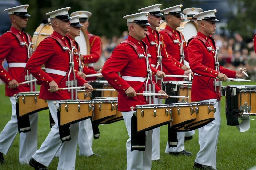 The U.S. Marine Drum & Bugle Corps performs during a Tuesday Sunset Parade at the Marine Corps War Memorial in Arlington, Va. Aug. 13.