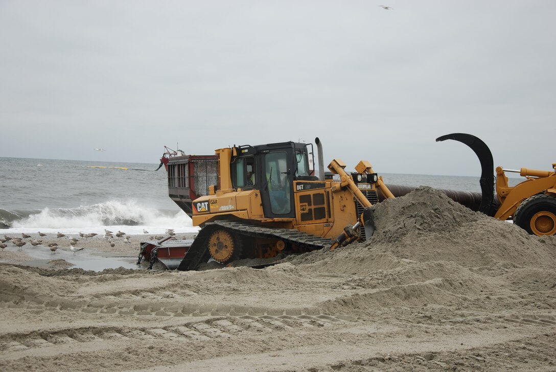 Crews are busy placing millions of cubic yards along the Atlantic coast of northern New Jersey as part of the U.S. Army Corps of Engineers, New York District’s efforts to repair and restore the Sea Bright to Manasquan beach erosion control and coastal storm risk reduction project. The work is being done to repair and restore the beach project after it was severely impacted by Hurricane Sandy.