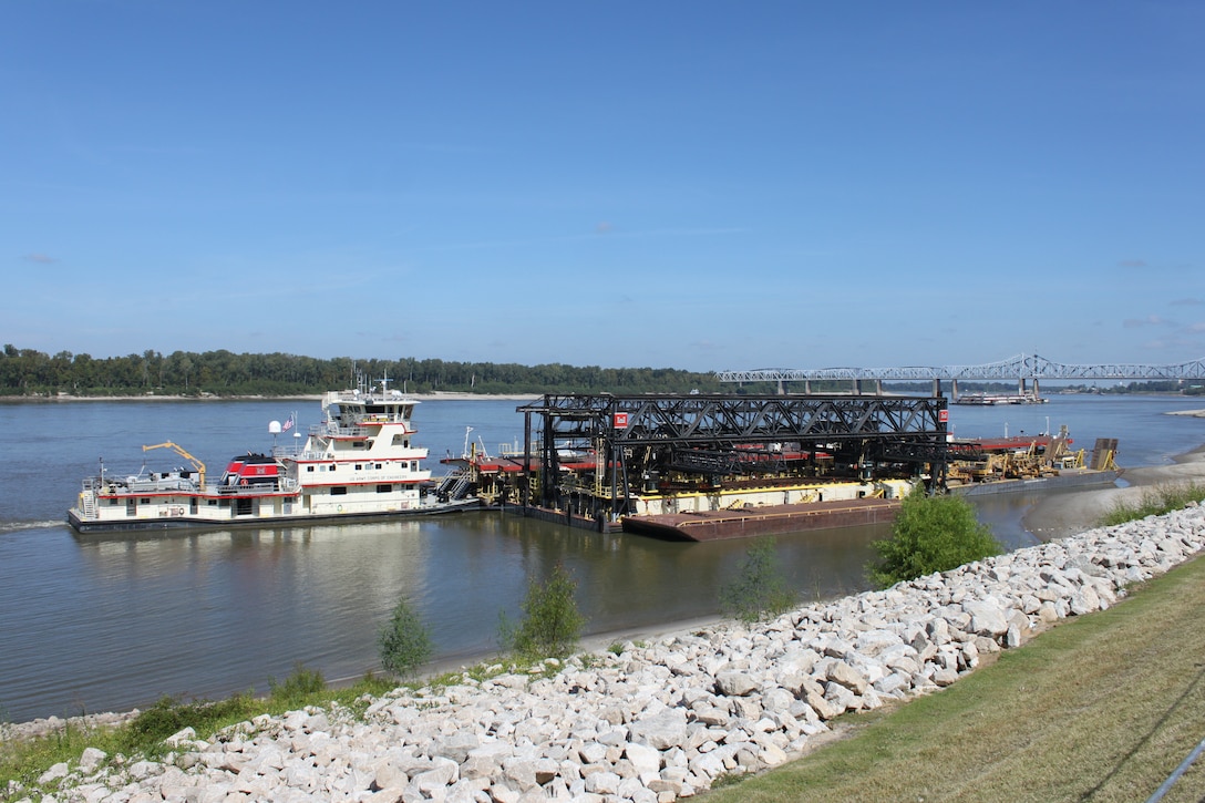 Vicksburg, Miss… The U. S. Army Corps of Engineers (Corps) Vicksburg District’s Mat Sinking Unit (MSU) is scheduled to begin laying articulated concrete mats on the banks of the Mississippi River on August 26.  The vessels of the MSU will depart the Vicksburg Harbor, Friday, 23 August 2013, and assemble around noon below the I-20 bridge before proceeding to their first worksite