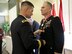 In ceremonies in Atlanta on August 13, South Atlantic Division Commander Brigadier General Donald (Ed) Jackson honors retiring Colonel Eric R.P. Conrad. Conrad retired after 28 years in the Army