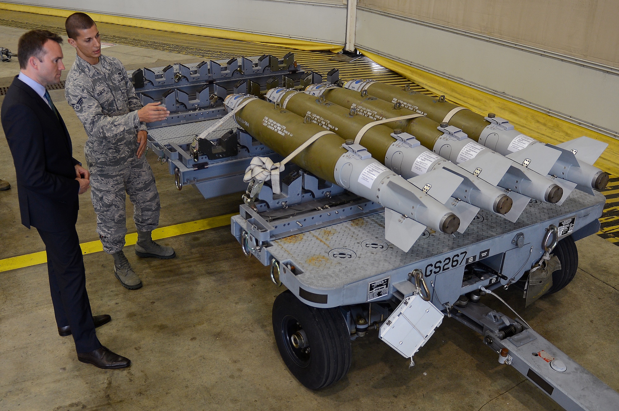 Senior Airman Gregory Quailer, 2nd Munitions Squadron conventional maintenance crew chief, speaks with Acting Secretary of the Air Force Eric Fanning about the Guided Bomb Unit during his visit to Barksdale Air Force Base, La., Aug. 14, 2013. Airmen from the 2nd MUNS spoke with Fanning about the GBU, the DATM-160 Miniature Air Launch Decoy and the Massive Ordnance Penetrator, all munitions the B-52H Stratofortress is capable of launching. (U.S. Air Force photo/Senior Airman Micaiah Anthony)
