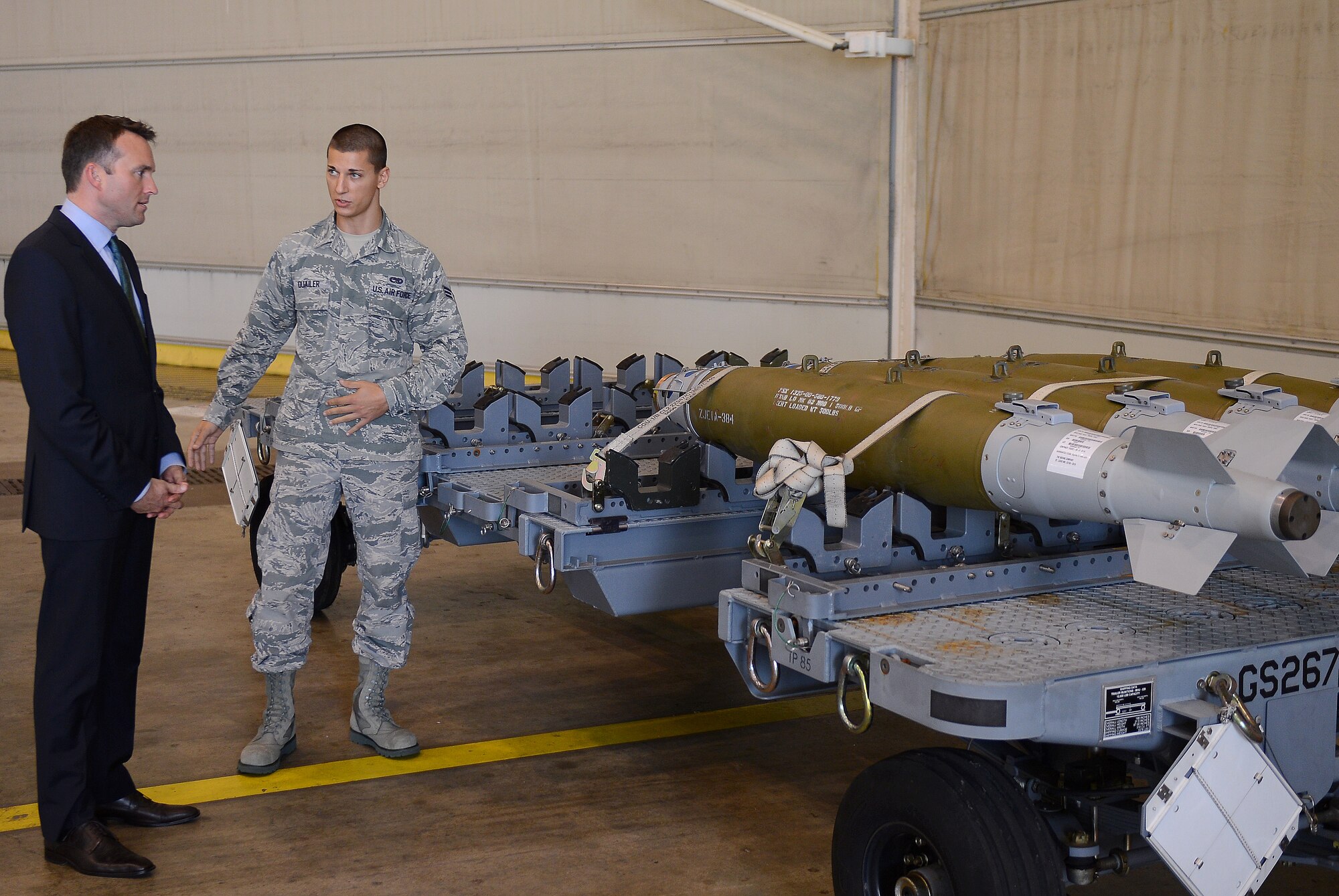 Senior Airman Gregory Quailer, 2nd Munitions Squadron conventional maintenance crew chief, speaks with Acting Secretary of the Air Force Eric Fanning about the Guided Bomb Unit during his visit to Barksdale Air Force Base, La., Aug. 14, 2013. Airmen from the 2nd MUNS spoke with Fanning about the GBU, the DATM-160 Miniature Air Launch Decoy and the Massive Ordnance Penetrator, all munitions the B-52H Stratofortress is capable of launching. (U.S. Air Force photo/Senior Airman Micaiah Anthony)