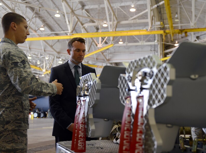 Senior Airman Gregory Quailer, 2nd Munitions Squadron conventional maintenance crew chief, speaks with Acting Secretary of the Air Force Eric Fanning about the DATM-160 Miniature Air Launch Decoy during his visit to Barksdale Air Force Base, La., Aug. 14, 2013. Through the munitions tour, Quailer shared with Fanning the capabilities of the MALD and its vitality to the bomber mission here. (U.S. Air Force photo/Senior Airman Micaiah Anthony)