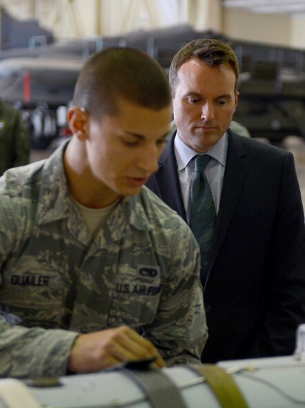 Senior Airman Gregory Quailer, 2nd Munitions Squadron conventional maintenance crew chief, speaks with Acting Secretary of the Air Force Eric Fanning about the DATM-160 Miniature Air Launch Decoy during his visit to Barksdale Air Force Base, La., Aug. 14, 2013. Through the munitions tour, Quailer shared with Fanning the capabilities of the MALD and its vitality to the bomber mission here. (U.S. Air Force photo/Senior Airman Micaiah Anthony)