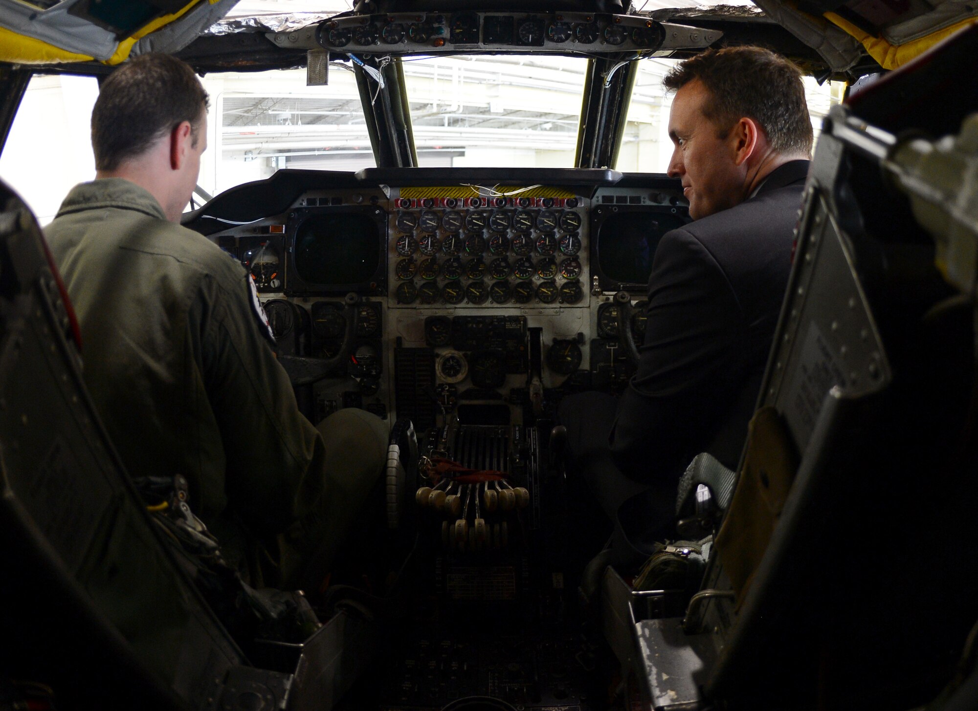 Capt. Shane Praiswater, 20th Bomb Squadron Charlie Flight assistant commander, speaks with Acting Secretary of the Air Force Eric Fanning about the flight deck of the B-52H Stratofortress during his visit to Barksdale Air Force Base, La., Aug. 14, 2013. Fanning learned about the 2nd Bomb Wing’s mission and the capabilities of the B-52 during a tour of the bomber. (U.S. Air Force photo/Senior Airman Micaiah Anthony)
