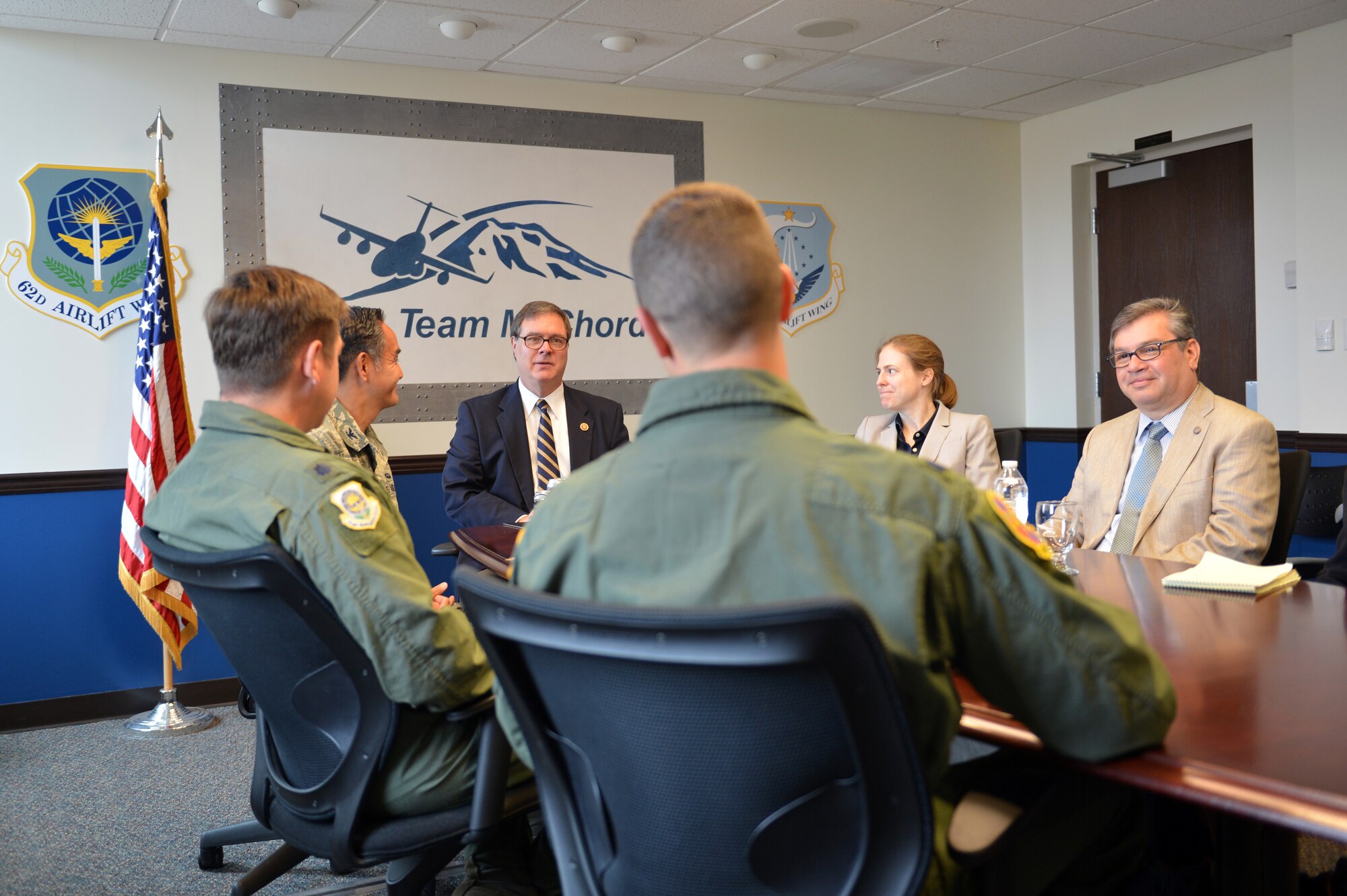 Congressman Denny Heck talks with Lt. Col. Charles Cooley, 62nd Operations Support Squadron commander (right) and Lt. Col. Brian Wald, 62nd Operations Group deputy commander about the C-17 Globemaster III’s mission here at McChord Field during a meeting with Col. David Kumashiro, 62nd Airlift Wing commander Aug. 14, 2013 at Joint Base Lewis-McChord, Wash. Congressman Heck visited the 62nd Airlift Wing to gain a better understanding of the unique mission-set of Team McChord. (U.S. Air Force photo/Staff Sgt. Jason Truskowski)
