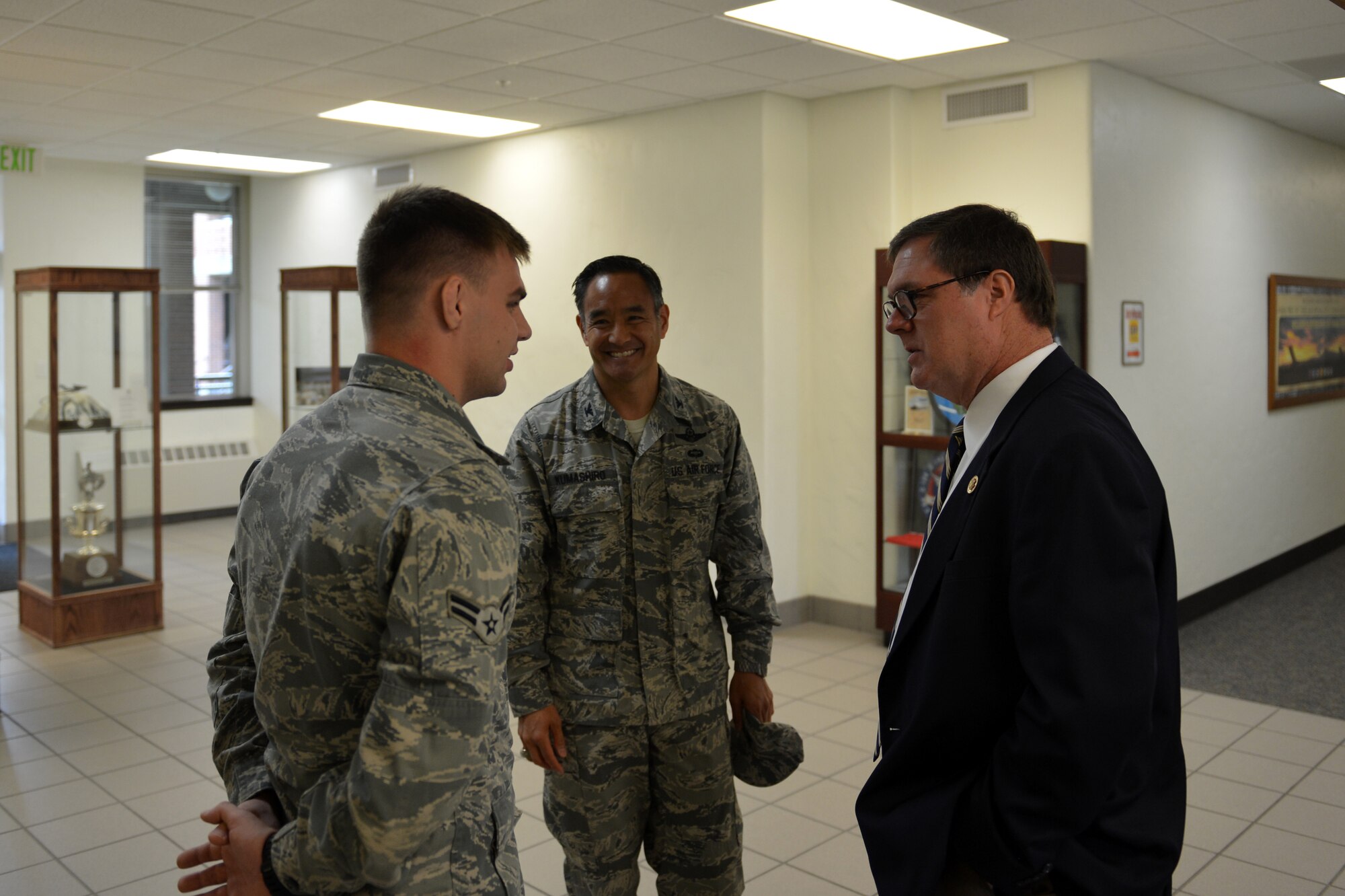 Airman 1st Class Shawn Flanagan, 8th Airlift Squadron loadmaster, talks about his hometown with Congressman Denny Heck Aug. 14, 2013 at Joint Base Lewis-McChord, Wash. Flanagan facilitated the 8th AS return from deployment family event, ensuring 75 families were taken care of. (U.S. Air Force photo/Staff Sgt. Jason Truskowski)