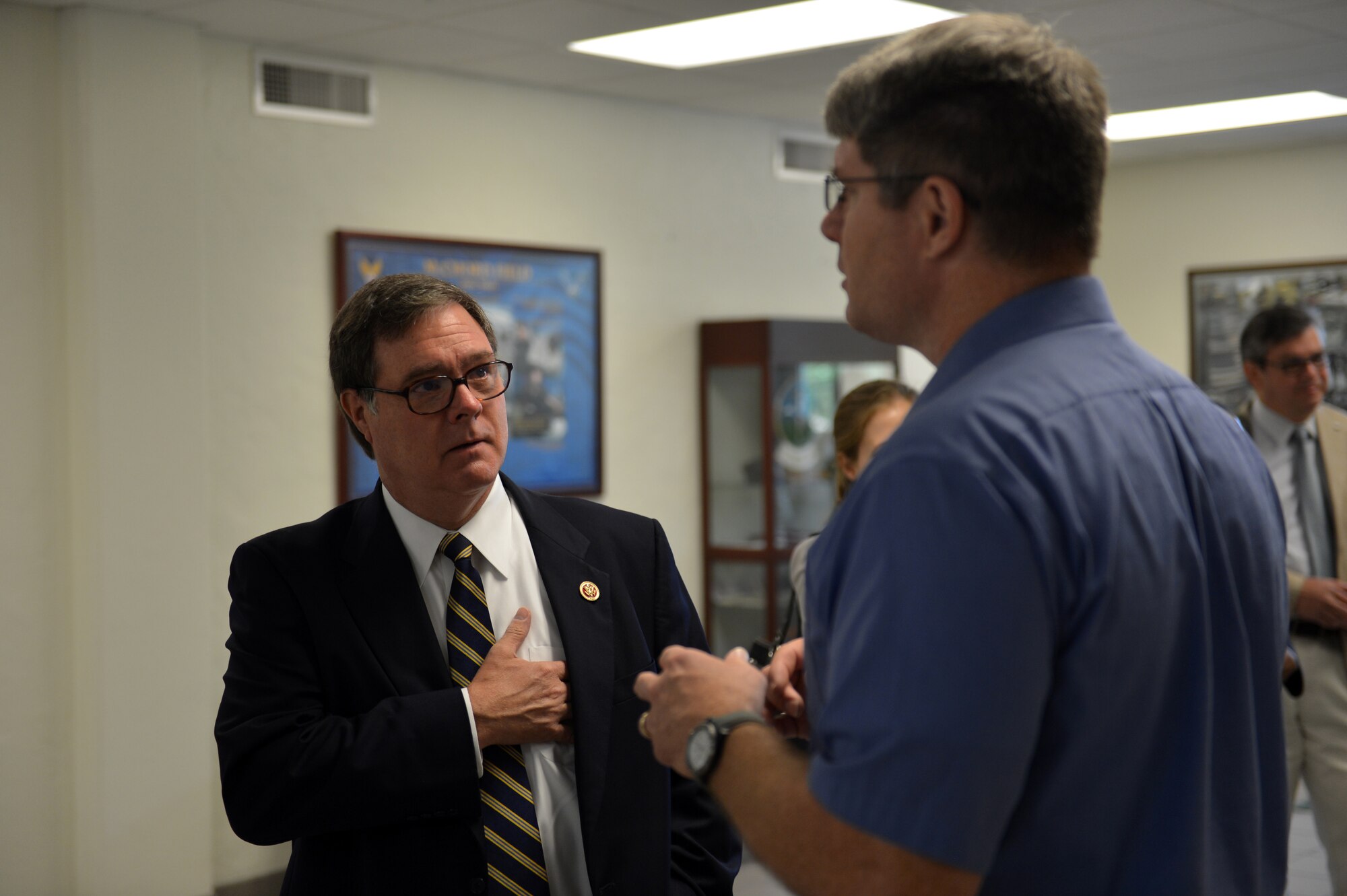 Tom Thompson, 62nd Airlift Wing Safety nuclear surety manager, talks with Congressman Denny Heck about furloughs Aug. 14, 2013 at Joint Base Lewis-McChord, Wash. Thompson is one of the many civilians who were affected by furloughs at JBLM. (U.S. Air Force photo/Staff Sgt. Jason Truskowski)