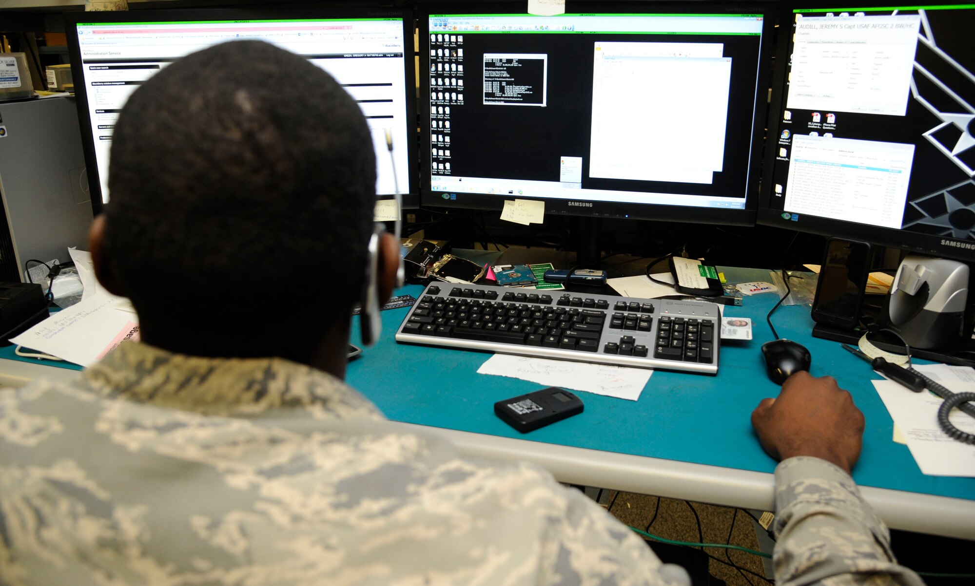 Staff Sgt. Gregory Green, 2nd Communications Squadron Client Systems Team client services technician, remotely controls a customer?s computer on Barksdale Air Force Base, La., Aug. 14, 2013. Controlling a computer remotely allows Green to install programs and trouble-shoot problems, and simultaneously work with a customer and handle equipment in the office. (U.S. Air Force photo/Airman 1st Class Andrew Moua)