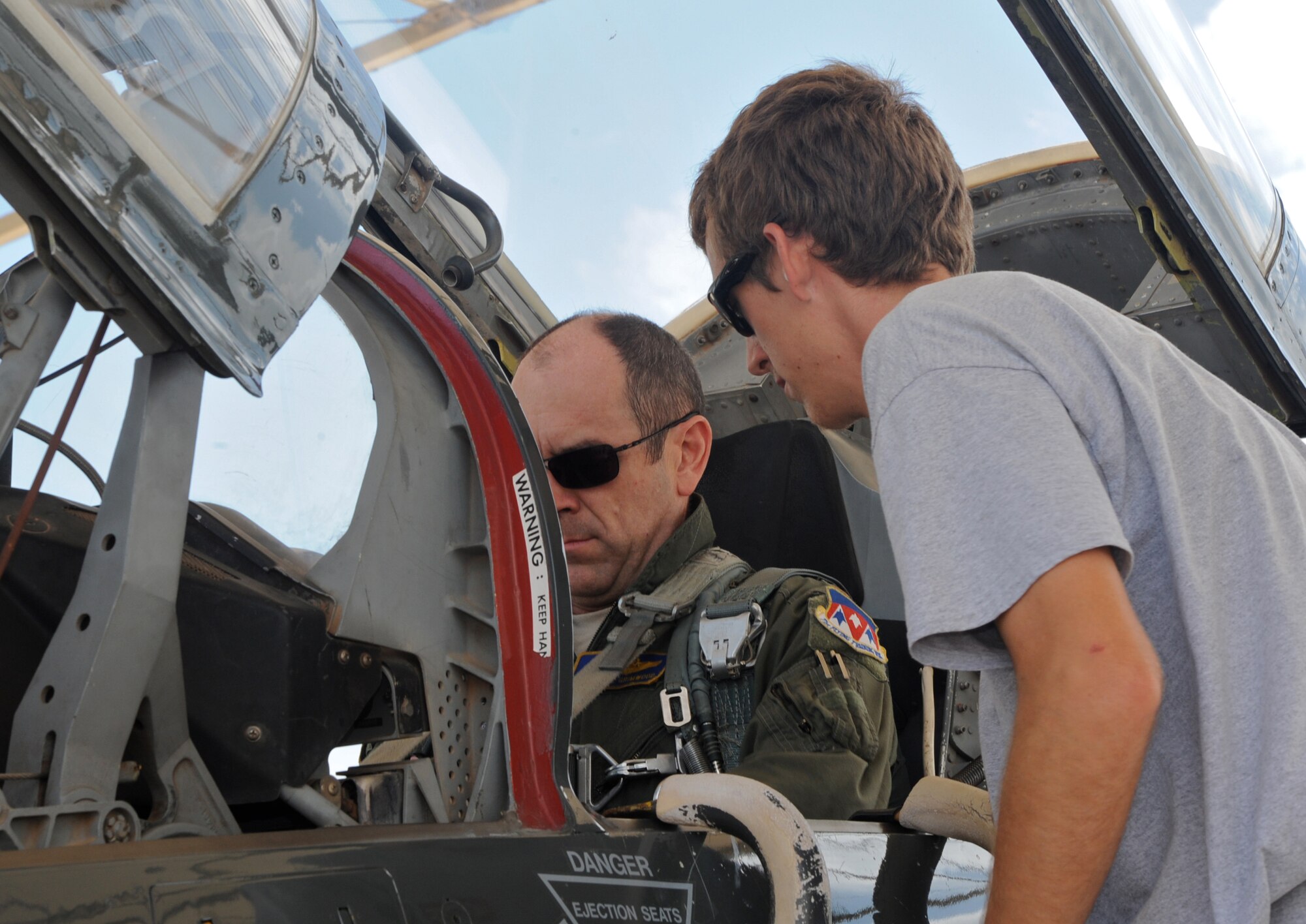 Blake Grimwood, right, worked on the flightline this summer launching T-38 training aircraft at Vance Air Force Base, Okla. Here, he is helping his father, Maj. Dave Grimwood, an instructor pilot with the 25th Flying Training Squadron, prepare for a flight. (U.S. Air Force photo/ Senior Airman Frank Casciotta)