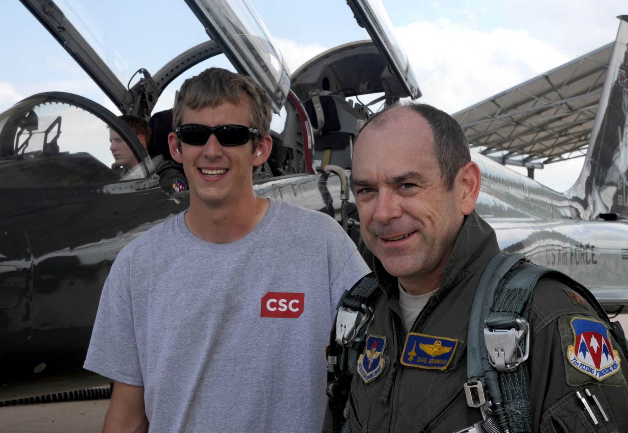 Blake Grimwood, left, and his father, Maj. Dave Grimwood, an instructor pilot with the 25th Flying Training Squadron at Vance Air Force Base, Okla. (U.S. Air Force photo/ Senior Airman Frank Casciotta)