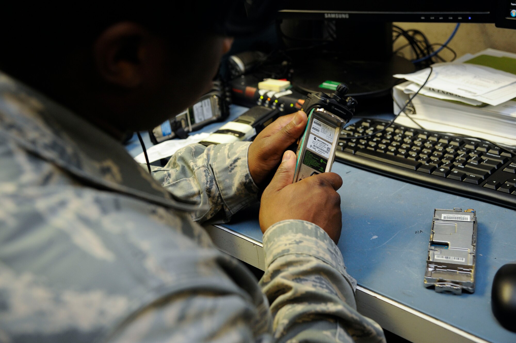Senior Airman Darryl Elliott, 2nd Communications Squadron Client Systems Team client services technician, begins the repairs on a radio handset on Barksdale Air Force Base, La., Aug. 2013. The most common issues with the handsets are encryption errors and broken screens and buttons. (U.S. Air Force photo/Airman 1st Class Andrew Moua)