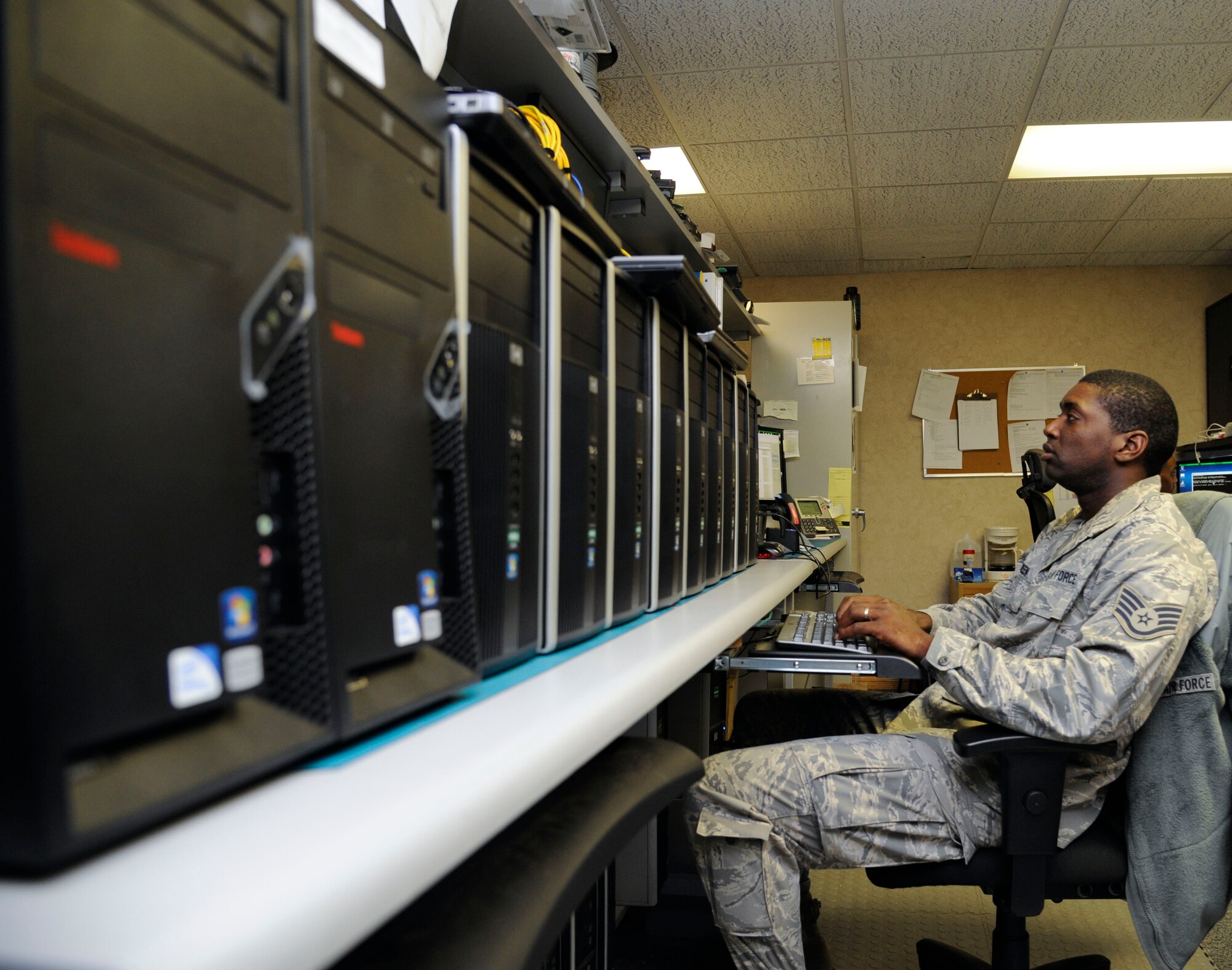 Staff Sgt. Gregory Green, 2nd Communications Squadron Client Systems Team client services technician, reformats computers on Barksdale Air Force, La., Aug. 14, 2013. The responsibilities of the 2nd CS CST Airmen include computer formatting, maintenance and repair of radios, and installing phone lines (U.S. Air Force photo/Airman 1st Class Andrew Moua)