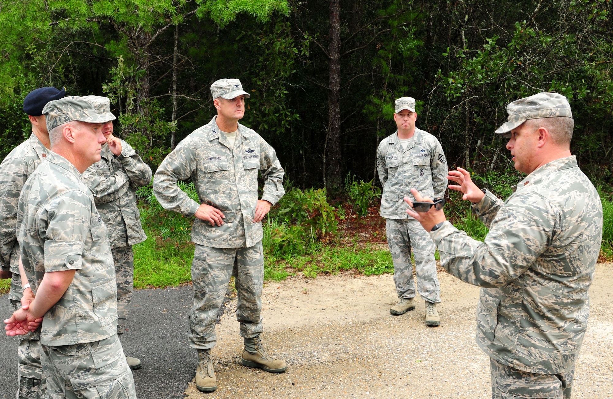 Brig. Gen.  Gary Ebben, Wis. Assistant Adjutant General for Air, left, and Col. Jeffrey Wiegand, 115th FW commander, center left, learn from Maj. James Habeck, the 96th GVTS commander, how security forces training at the 96th Ground Combat Training Squadron prepares their Airmen prepare for deployment.    26 Security Forces Airmen from the 15th Fighter Wing, Madison, Wis., participate in pre-deployment training at Eglin Air Force Base, Fla., Aug. 1313 and made final preparations for a six-month deployment to provide base defense at an undisclosed location in Southwest Asia.  The training is part of a 21-day program designed to give Airmen the latest in real world threats and prepare them for success while deployed.  (Air National Guard photo by Staff Sgt. Ryan Roth)
