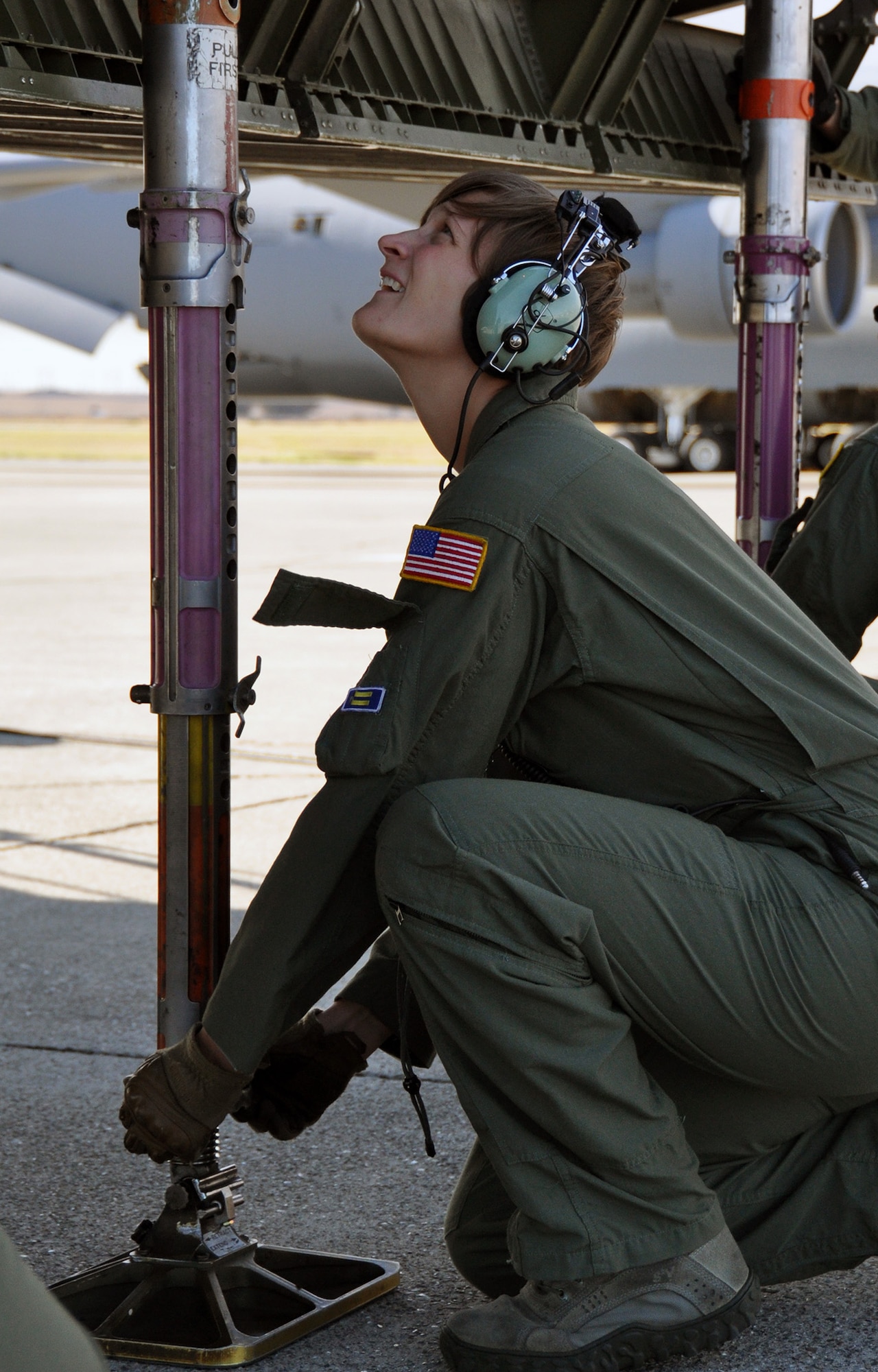 TRAVIS AIR FORCE BASE, Calif, -- Tech. Sgt. Renea Zachary, a C-5 Galaxy loadmaster part of the 312th Airlift Squadron, puts away a jack part of a C-5 Galaxy on August 7, 2013. Zachary has been part of the unit since November. (U.S. Air Force photo / Senior Airman Cindy Alejandrez)