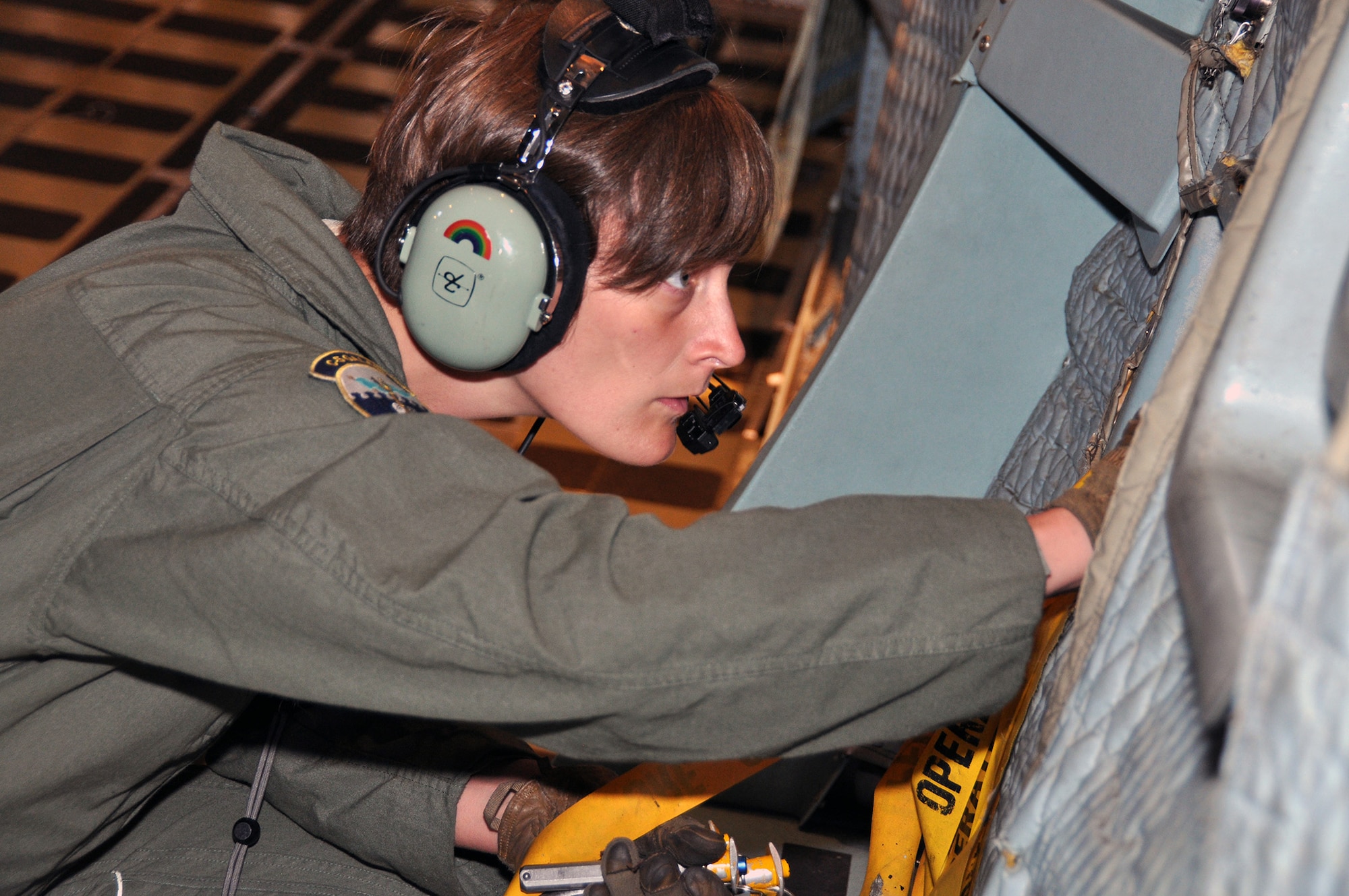 TRAVIS AIR FORCE BASE, Calif, -- Tech. Sgt. Renea Zachary, a C-5 Galaxy loadmaster part of the 312th Airlift Squadron, puts away pins, pulled from the aircraft, during a loadmaster training day, on August 7, 2013. The Dallas, Texas, native will be competing in the upcoming 2013 United States Air Forces in Europe Headquarters Air Command Athletics Championships in Furstenfeldbruck, Germany, in September. (U.S. Air Force photo / Senior Airman Cindy Alejandrez)