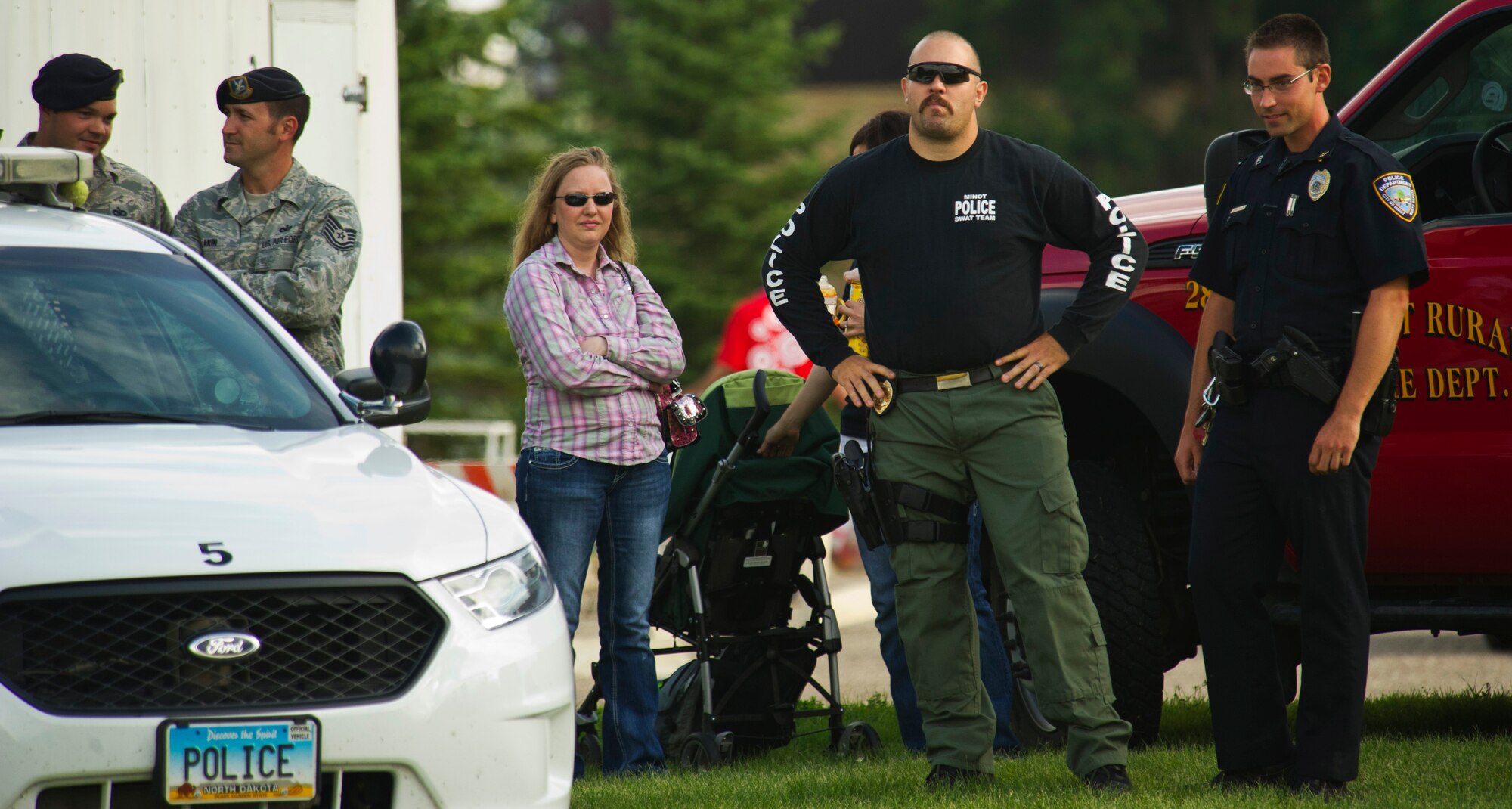 The Minot Police Department teamed up with Minot Air Force Base, community partners and fellow public service agencies to host its annual National Night Out event in Minot, N.D., Aug. 6, 2013. The event was devised to encourage stronger relationships between neighbors and local law enforcement in order to heighten crime-prevention awareness and recognize emergency service members for their selfless work protecting the local community. (U.S. Air Force photo/Senior Airman Brittany Y. Auld)