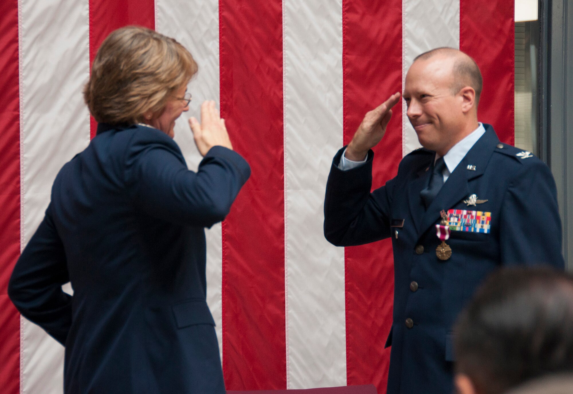 TRAVIS AIR FORCE BASE, Calif. -- Col. Craig Wells, 349th Mission Support Group, receives the meritorious service medal and pins on the rank of colonel during a pinning-on ceremony held here at Travis Air Force Base, Calif. on August 10, 2013. ( U.S Air Force photo / Senior Airman Amelia Leonard) 