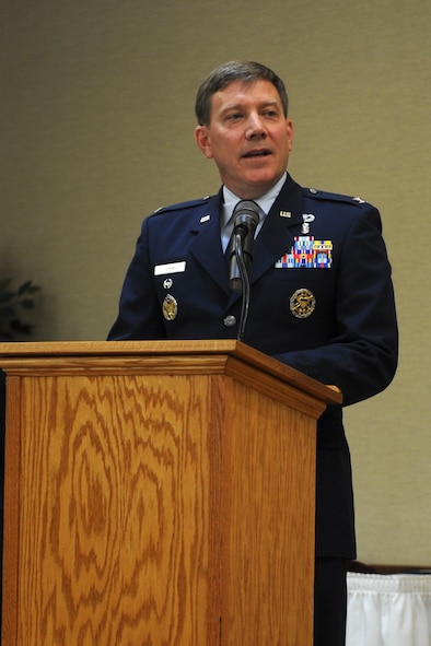 Retired U.S. Air Force Col. Larry Kimm gives remarks during a retirement ceremony honoring Col. Alvis Headen III, 23d Medical Group commander, Aug. 9, 2013, at Moody Air Force Base, Ga. Kimm and Headen met as young officers while attending bioenvironmental engineering training in 1988. (U.S. Air Force photo by Airman Alexis A. Grotz/Released)