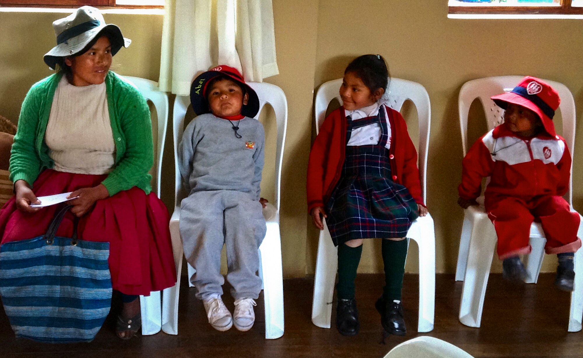 A Peruvian family waits for their turn to be seen by medical professionals as part of the free clinics provided by Healing Peru. Healing Peru is a humanitarian mission that consisted of 14 military medical specialists, including five from Eglin Air Force Base, Fla., who provided free medical services, preventive health care and health education to the natives of Andahuaylillas, Peru. (Courtesy photo)
