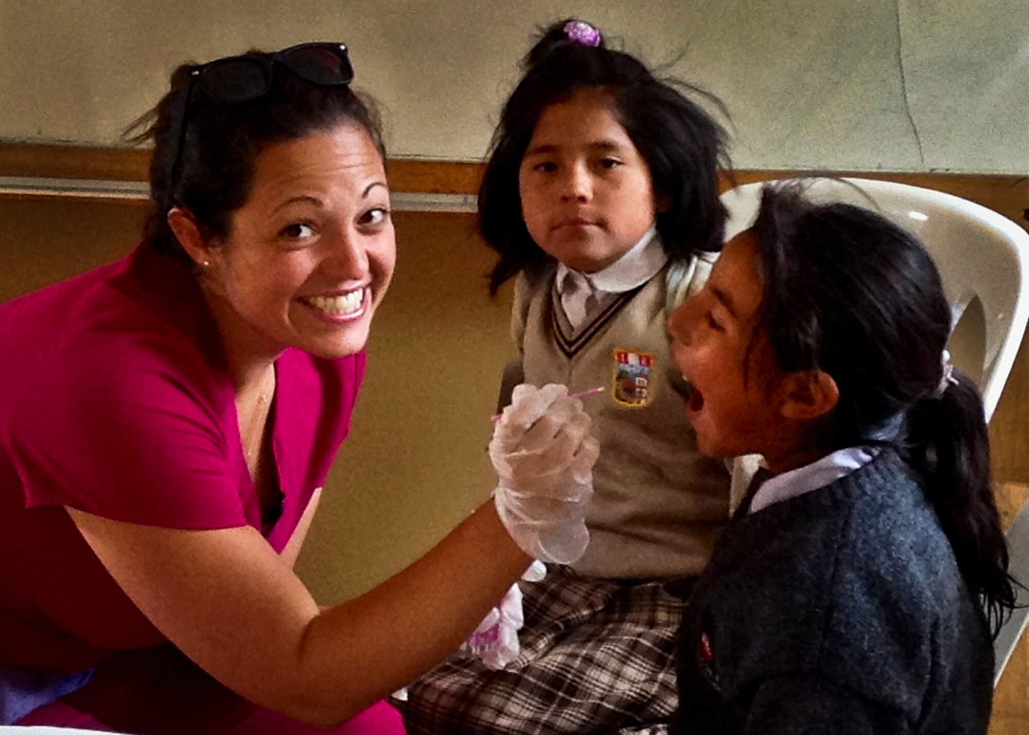 Capt. Hannah Diaz, a nurse-midwife from the 96th Surgical Operations Squadron, administers fluoride dental treatments to children during a free clinic. She was one of 14 military medical specialists on a mission trip called Healing Peru. The team provided free medical services, preventive health care and health education to the natives of Andahuaylillas, Peru. (Courtesy photo)
