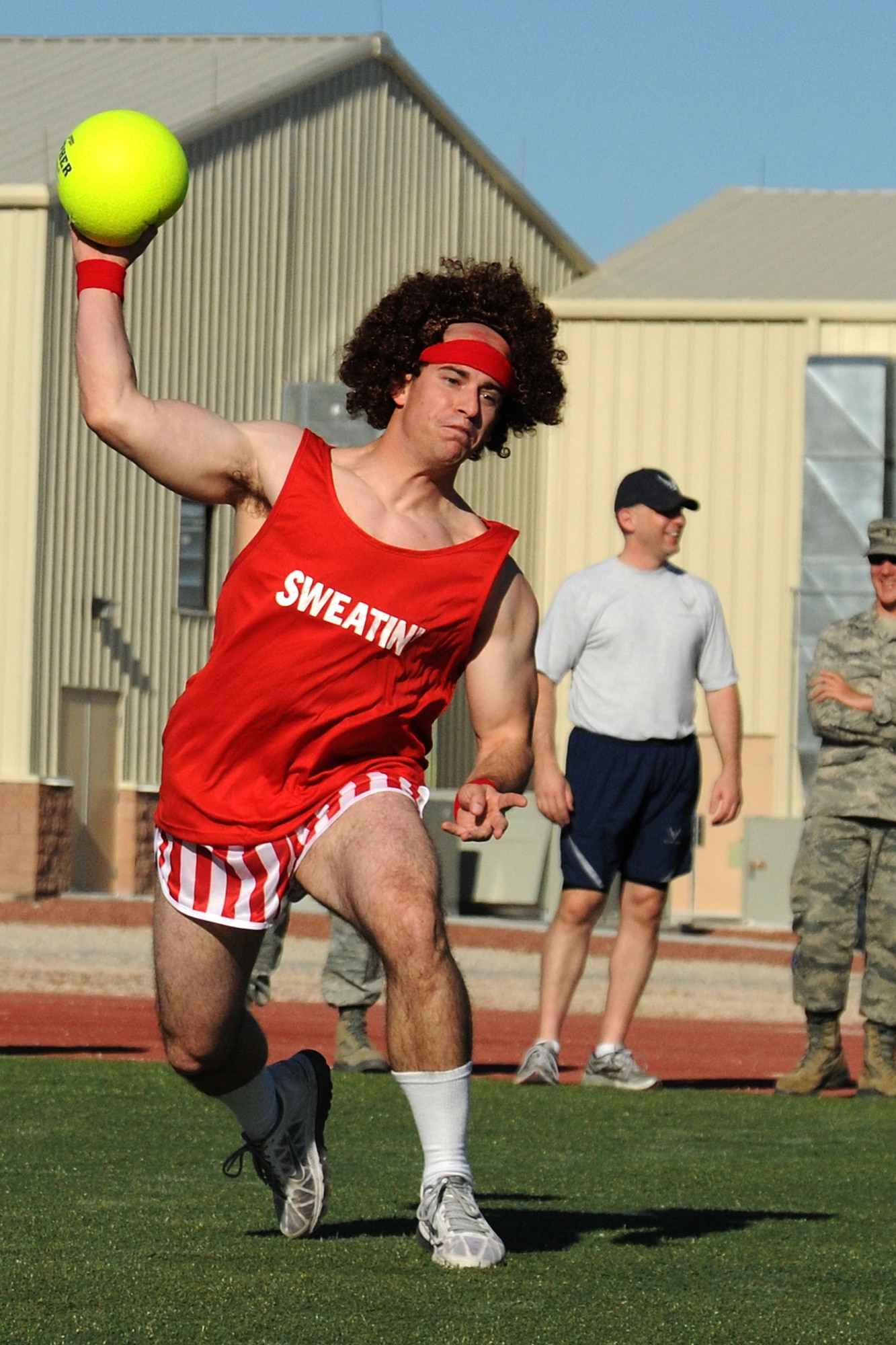LAS VEGAS, Nev. -- An Airman with the 432nd Wing/432nd Air Expeditionary Wing throws a ball during the wing’s Comprehensive Airmen Fitness Day dodge ball tournament, Aug. 9, 2013. The day’s event was to provide a fun and different approach to help strengthen Airmen’s understanding and application of CAF through interactive training and team-building activities. (U.S. Air Force photo by Staff Sgt. N.B./released)