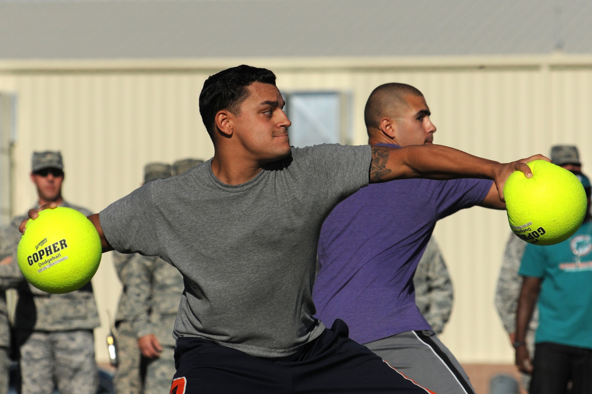 LAS VEGAS, Nev. -- Airmen double team opposing competitors during the 432nd Wing/ 432nd Air Expeditionary Wing’s Comprehensive Airmen Fitness Day dodge ball tournament, Aug. 9, 2013. The day’s event was to provide a fun and different approach to help strengthen Airmen’s understanding and application of CAF through interactive training and team-building activities. (U.S. Air Force photo by Staff Sgt. N.B./released)