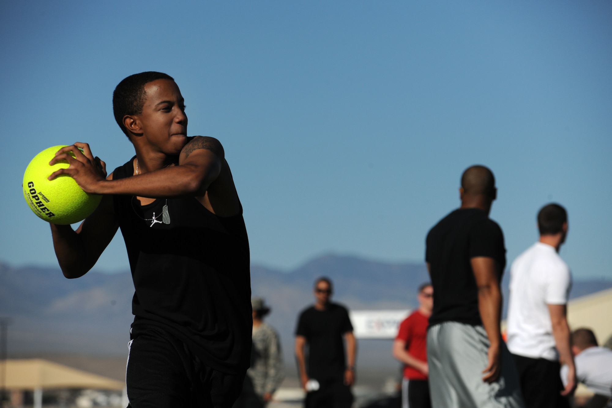 LAS VEGAS, Nev. -- An Airman prepares to throw a ball during the 432nd Wing/ 432nd Air Expeditionary Wing’s Comprehensive Airmen Fitness Day dodge ball tournament, Aug. 9, 2013. The day’s event was to provide a fun and different approach to help strengthen Airmen’s understanding and application of CAF through interactive training and team-building activities. (U.S. Air Force photo by Staff Sgt. N.B./released)