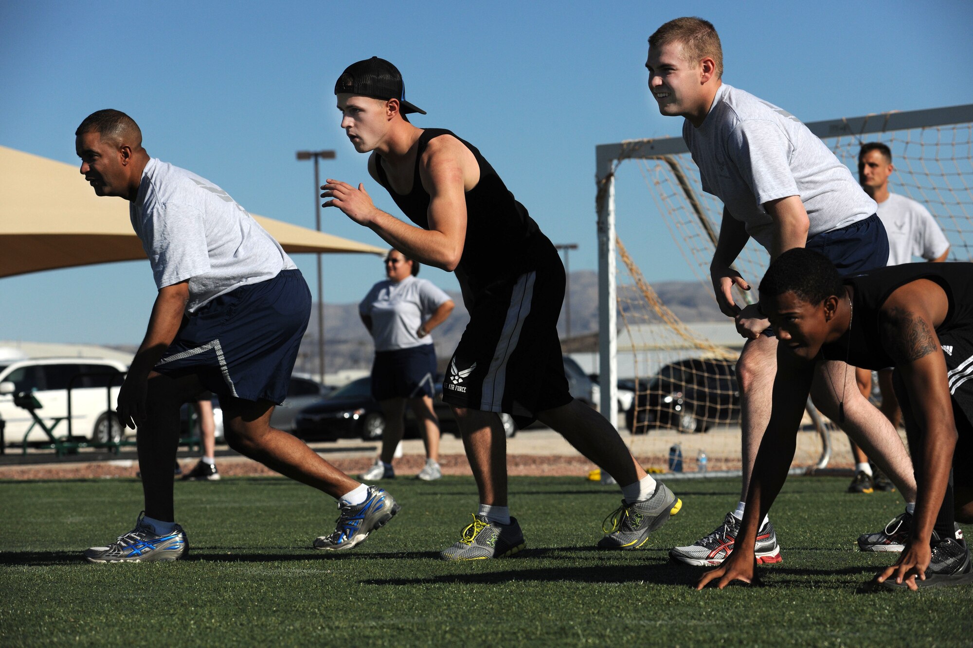 LAS VEGAS, Nev. -- Airmen from the 432nd Wing/ 432nd Air Expeditionary Wing, prepare to storm the field at the wing’s Comprehensive Airmen Fitness Day dodge ball tournament, Aug. 9, 2013. The day’s event was to provide a fun and different approach to help strengthen Airmen’s understanding and application of CAF through interactive training and team-building activities. (U.S. Air Force photo by Staff Sgt. N.B./released)