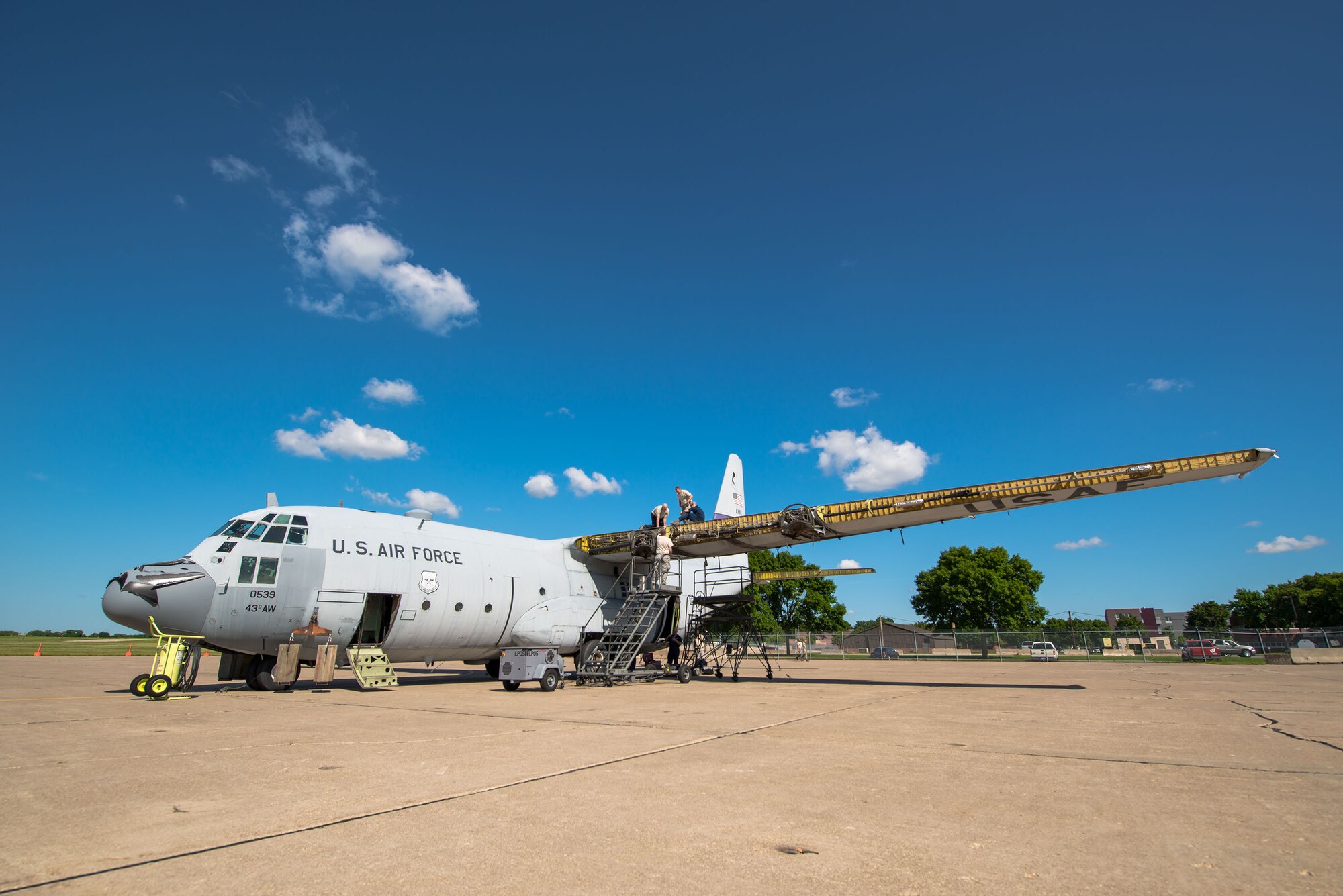 Members of the 402nd Expeditionary Maintenance Group work to dismantle a retired C-130 aircraft at Minneapolis-St. Paul Air Reserve Station, Minn.  (U.S. Air Force photo/Keith Langsdorf)