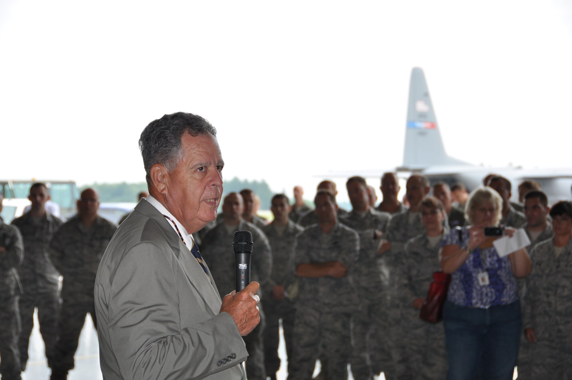 MANSFIELD-LAHM AIR NATIONAL GUARD BASE, Ohio – The Honorable Dennis M. McCarthy, chairman of the National Commission on the Structure of the Air Force, talks to an audience gathered in a hangar here, July 30, 2013. The audience included Airmen from the Ohio National Guard (OHNG)’s 179th Airlift Wing based here, OHNG leadership and Citizen Airmen of the Air Force Reserve’s 910th Airlift Wing, based at nearby Youngstown Air Reserve Station (YARS), Ohio.   McCarthy is a retired Marine Corps lieutenant general and the previous assistant secretary of Defense for Reserve Affairs at the Pentagon. A team of Citizen Airmen from YARS highlighted the capabilities the 910th and the air station during the meetings with the commission. The NCASF was formed to conduct a comprehensive study of the structure of the Air Force to determine whether, and how, the structure should be modified to best fulfill current and anticipated mission requirements for the Air Force consistent with available resources.