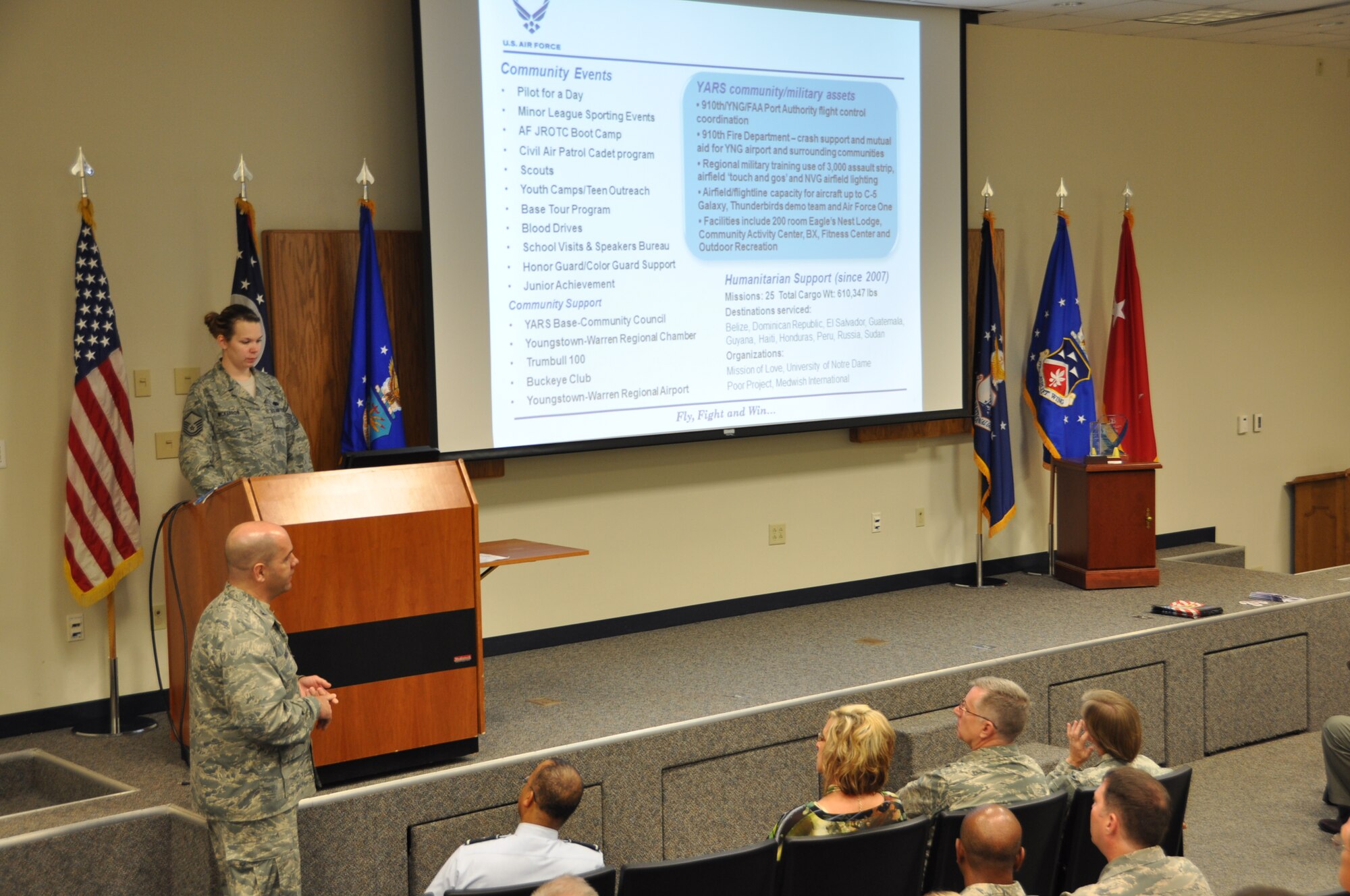 MANSFIELD-LAHM AIR NATIONAL GUARD BASE, Ohio – Air Force Reserve Col. James Dignan, commander of the 910th Airlift Wing, based at nearby Youngstown Air Reserve Station (YARS), Ohio, provides a wing mission briefing to an audience including members of the National Commission on the Structure of the Air Force here, July 30, 2013. A team of Citizen Airmen from YARS highlighted the capabilities the 910th and the air station during the meetings with the commission. The NCASF was formed to conduct a comprehensive study of the structure of the Air Force to determine whether, and how, the structure should be modified to best fulfill current and anticipated mission requirements for the Air Force consistent with available resources.