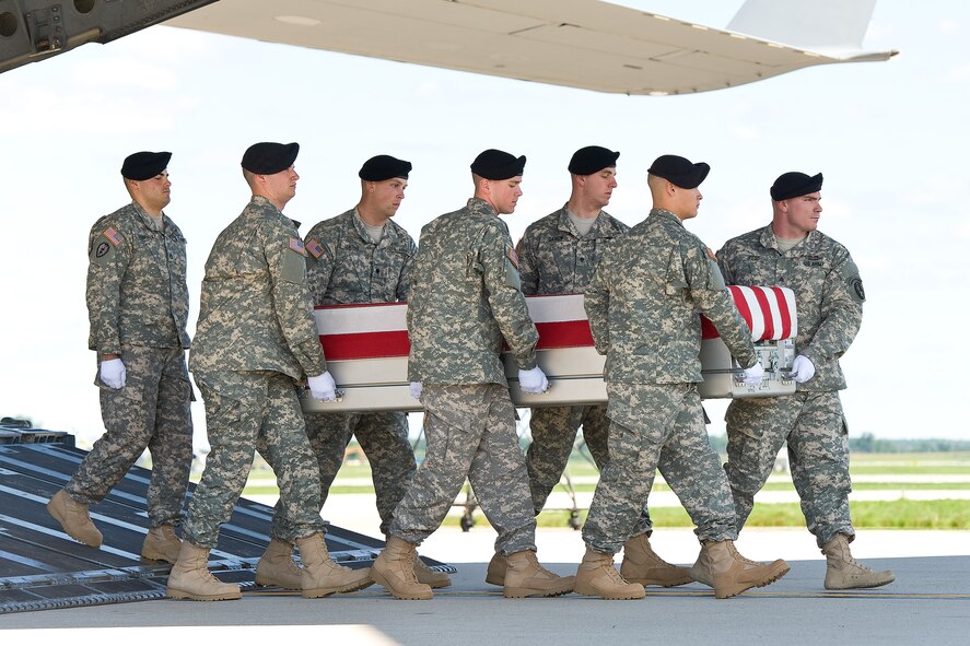 A U.S. Army carry team transfers the remains of Army Staff Sgt. Octavio Herrera of Caldwell, Idaho, Aug. 14, 2013 at Dover Air Force Base, Del. Herrera was assigned to the 4th Battalion, 320th Field Artillery Regiment, 4th Brigade Combat Team, 101st Airborne Division, Fort Campbell, Ky. (U.S. Air Force photo/Roland Balik)