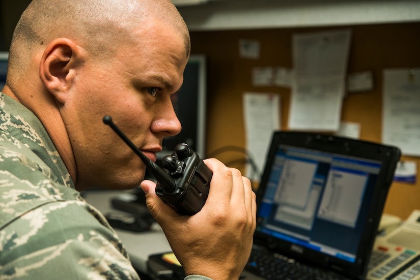 Staff Sgt. Robert Hendrickson, 628th Communication Squadron noncommissioned officer-in-charge of radio frequency transmission systems, tests a radio after reprogramming a land mobile radio system Aug. 12, 2013, at Joint Base Charleston - Air Base, S.C. The RF transmission systems flight maintains all of the land mobile radio systems covering JB Charleston, as well as public address support. (U.S. Air Force photo/ Senior Airman George Goslin)