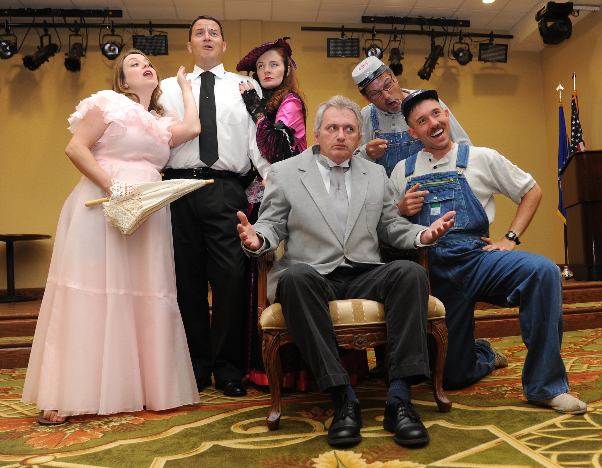 Kate Sawyer, Ric Sawyer, Donna Taylor, Barry Newman, Brian Giglione and Airman 1st Class Seth Balla, 338th Training Squadron, get into character for a group photo for the murder mystery dinner theater performance, “Frankly, Scarlett, You’re Dead!” on Aug. 6, 2013, at the Bay Breeze Event Center, Keesler Air Force Base, Miss. The performance is schedule for Aug., 23-24, in the ballroom at the Bay Breeze Event Center.   (U.S. Air Force photo by Kemberly Groue)